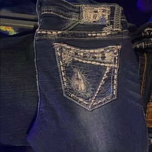 Grace in LA Blue Jeans with Distinctive Stitching